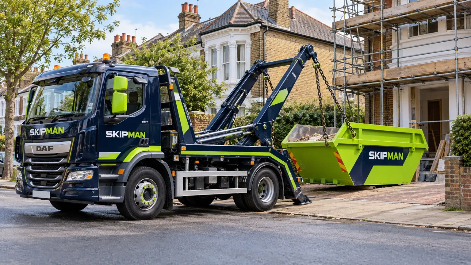 SKIPMAN skip lorry placing an open skip outside a London renovation project