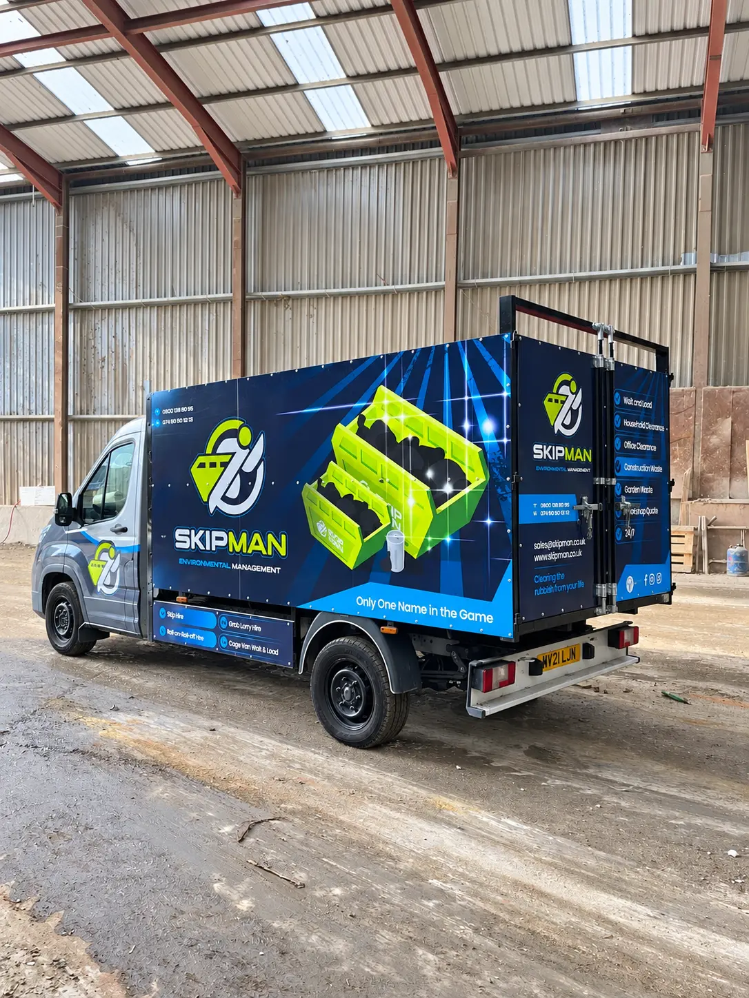 Branded SKIPMAN cage van ready for rubbish removal