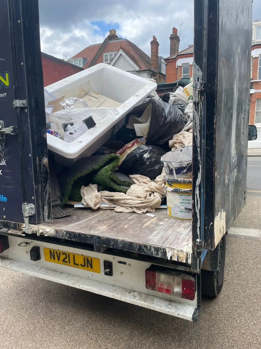 Bulky household waste loaded into the SKIPMAN cage van