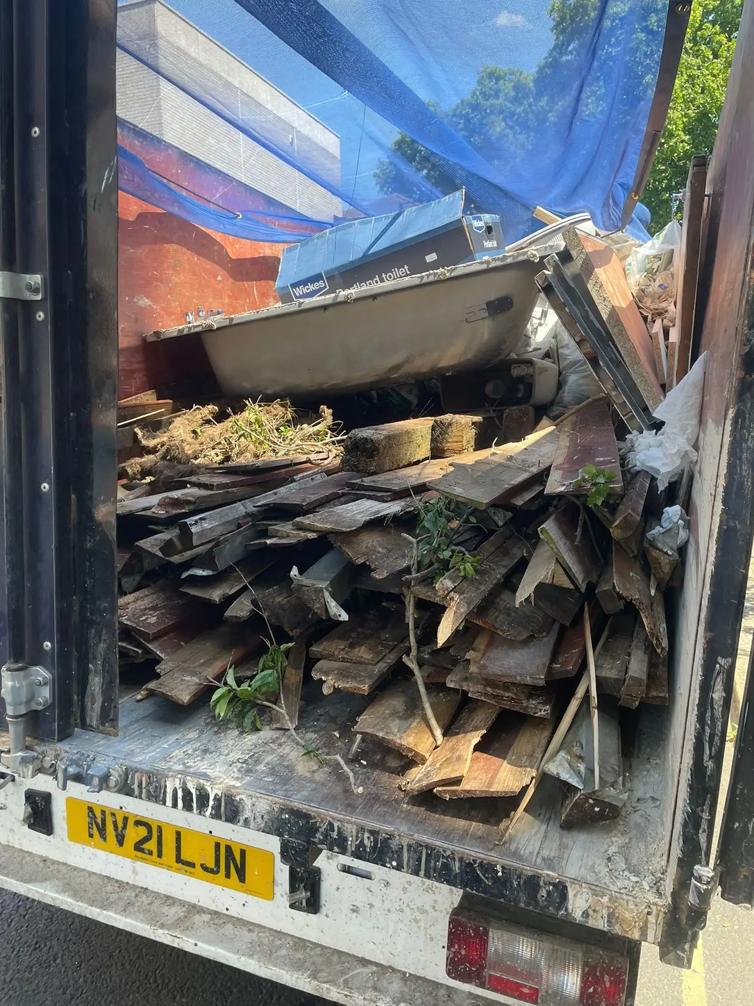 Heavy timber and renovation waste loaded into the SKIPMAN cage van